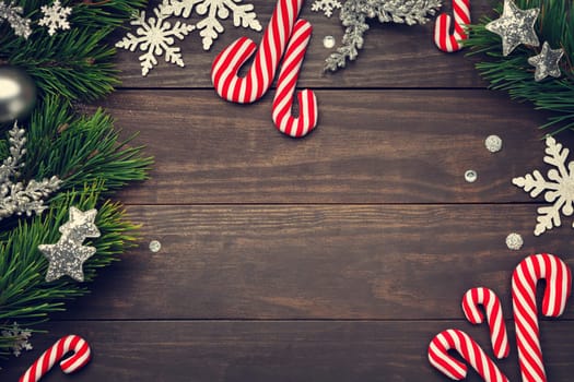 Christmas background with decorations on wooden table. Copy space. Top view