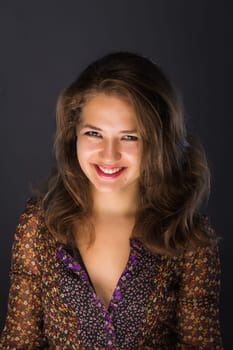 Young brunette woman with beautiful smile