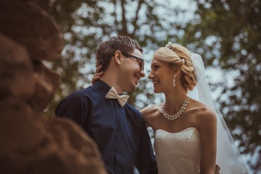 Beautiful young bride and groom in a park