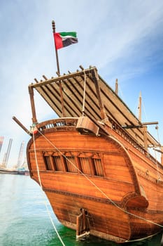 Bow of a traditional Arabian ship moored by Corniche in Sharjah, UAE