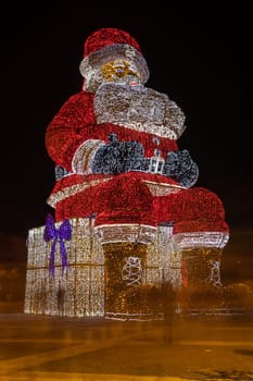 AGUEDA, PORTUGAL - CIRCA DECEMBER 2018: Worlds biggest Santa Claus with 21 meters hight, iluminated by 250. 000 Christmas lights.