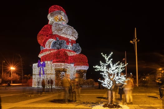 AGUEDA, PORTUGAL - CIRCA DECEMBER 2018: Worlds biggest Santa Claus with 21 meters hight, iluminated by 250. 000 Christmas lights.