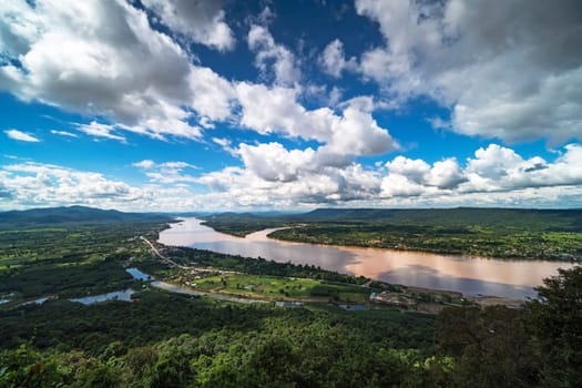 Mekong River At Nong Khai In Thailand, high angle view of landscape with cumulus clouds