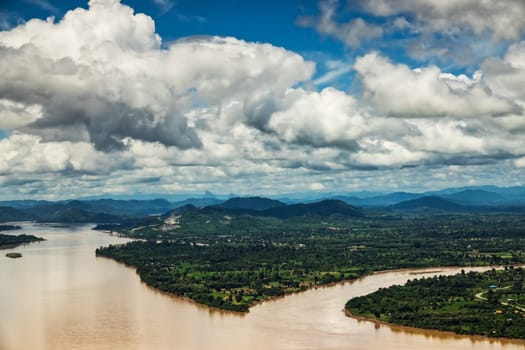Mekong River At Nong Khai In Thailand, high angle view of landscape with cumulus clouds