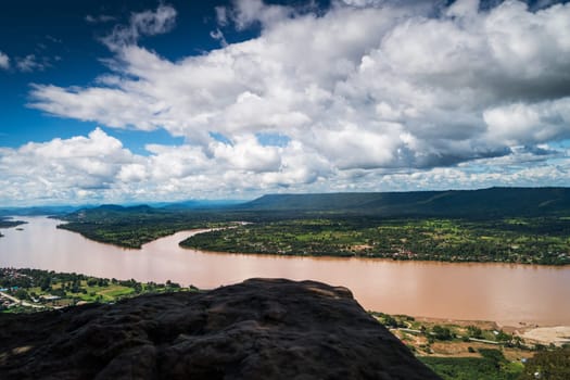 Mekong River At Nong Khai In Thailand, high angle view of landscape with cumulus clouds