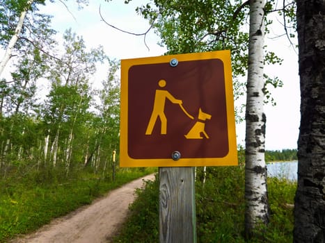 Dogs Must Be Kept on Leash On a Hiking Trail.