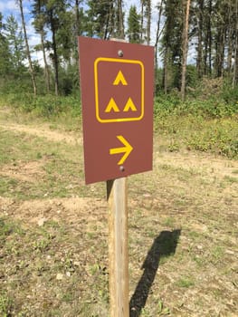 Group Camping Sign Along Side a Road.