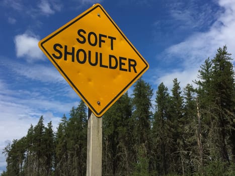 Soft Shoulder Sign Against Blue Sky.