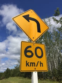Suggested Sixty Kilometer Per Hour Sign Around Bend.