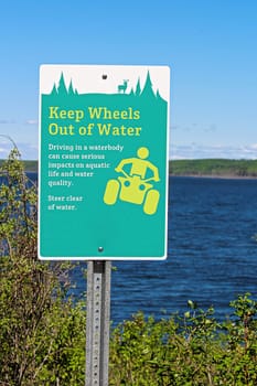 Keep wheels out of water sign along a lakeshore.