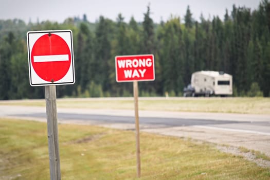 A Do Not Enter and Wrong Way sign on a highway.