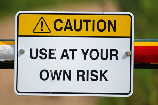A caution use at your own risk sign.