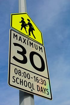 School Zone Sign with a Maximum Speed and Effective Hours