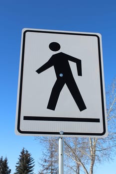 Crosswalk on a White Rectangle Sign