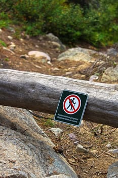 Restoration in progress signs on temporarily closed trails.