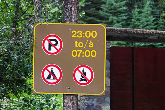 No parking, camping or fires during the night time sign.