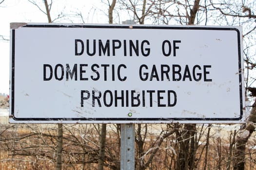 Dumping of domestic garbage prohibited sign.
