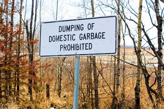 Dumping of domestic garbage prohibited sign.
