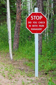 A stop, did you check with the park manager sign.