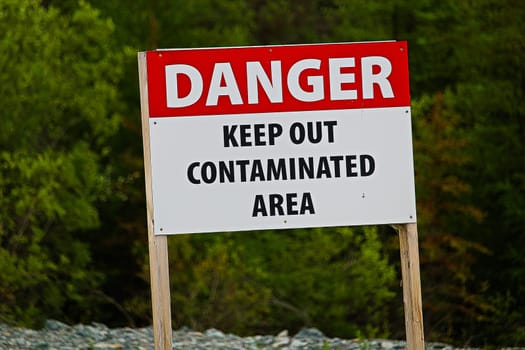 Closeup of a danger keep out of contaminated area sign.