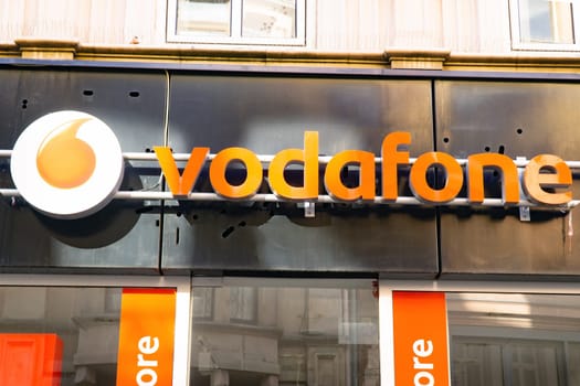 Wiesbaden, Germany - June 03 2018: Vodafone logo on a facade. Vodafone is a British multinational telecommunications company and the world's 2nd-largest mobile telecommunications provider.