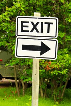A exit sign with a directional arrow.