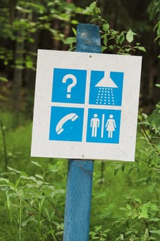 An information sign at a campground washrooms and showers.