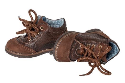 Child shoe fashion. A pair of elegant brown leather shoes with shoelaces for little boys isolated over white background. Leather and suede shoes for spring or autumn.