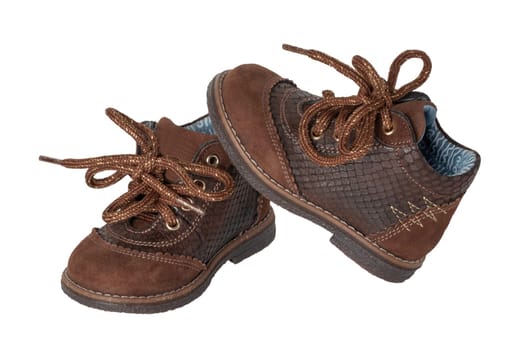 Child shoe fashion. A pair of elegant brown leather shoes with shoelaces for little boys isolated over white background. Leather and suede shoes for spring or autumn.