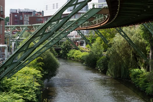The supporting framework of the Wuppertaler suspension railway consists of a steel framework with inclined supports and suspended steel bridges so-called Rieppelträger.