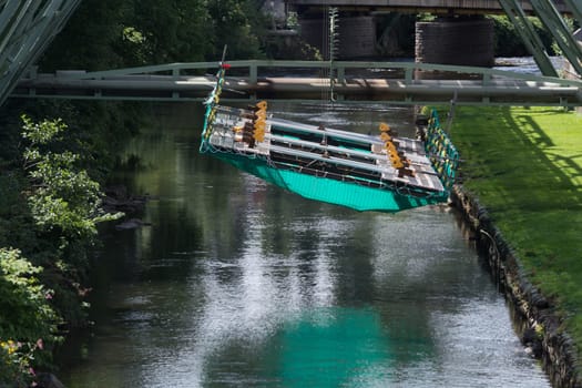 The supporting framework of the Wuppertaler suspension railway consists of a steel framework with inclined supports and suspended steel bridges so-called Rieppelträger.