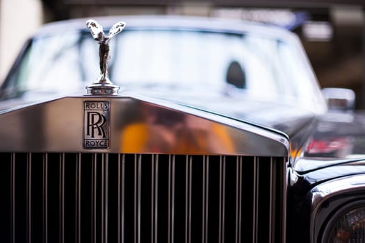 BERLIN, GERMANY - JUNE 28, 2018: Rolls-royce logo. Close-up of front part classic vintage car. Germany Exhibition