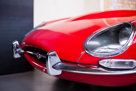 Classic vintage car. Close-up of headlights of luxurious vintage vehicle