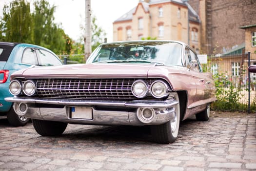 Classic vintage car. Close-up of headlights of luxurious vintage vehicle