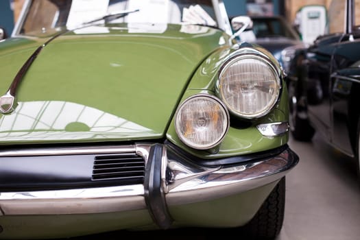 Close-up of headlights classic vintage car. Germany Exhibition