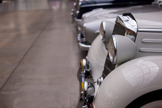 Classic vintage car. Close-up of headlights of luxurious vintage vehicle