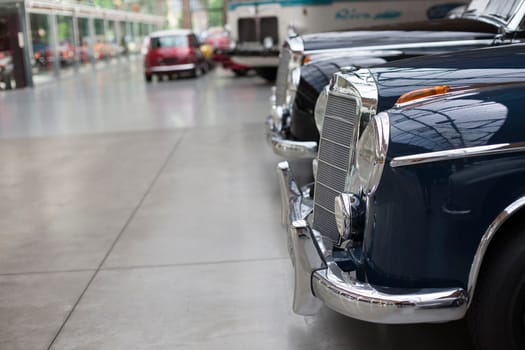 Classic vintage car. Close-up of headlights of luxurious vintage vehicle