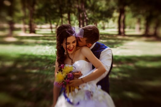 Married Couple in forest embracing