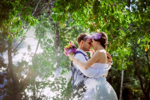 Married Couple in forest embracing