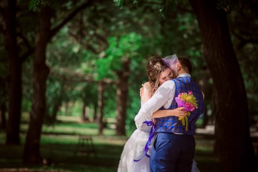 the newly married couple standing at park