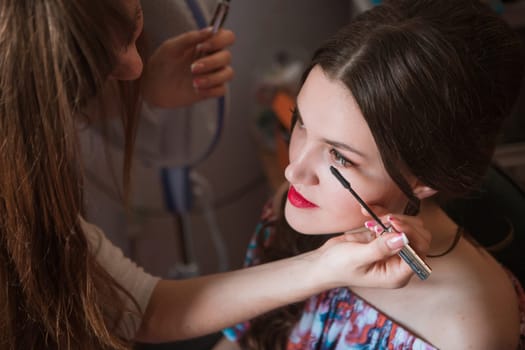 Beautiful bride with wedding makeup and hairstyle, attractive newlywed woman have final preparation for wedding. Bride waiting groom. Happy newlywed. Marriage. Wedding day moments. Bride makeup.