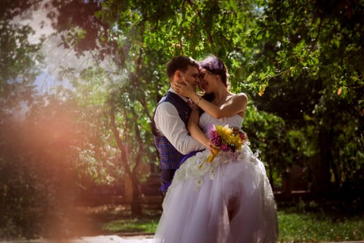 Married Couple in forest embracing