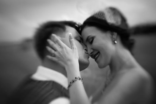 bride and groom near hay barn