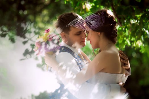 Married Couple in forest embracing