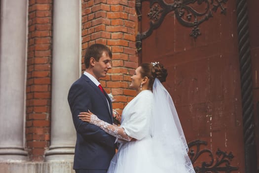 A beautiful bride and handsome groom at church during wedding