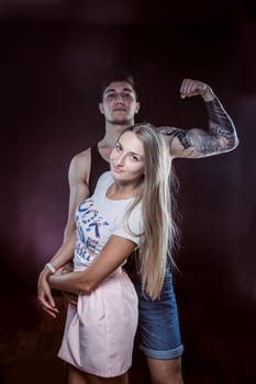 Sexy passion couple, beautiful young man and woman closeup, studio shot
