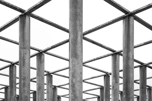 Cement Columns Chair Rough Texture Perspective Overhead Grid Geometric Pattern Design Outdoor Park Public Upright Minimal Bright Stone