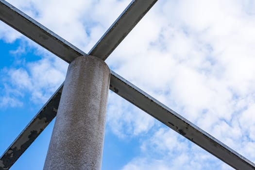Cement Columns Chair Rough Texture Perspective Overhead Grid Geometric Pattern Design Outdoor Park Public Upright Minimal Bright Stone