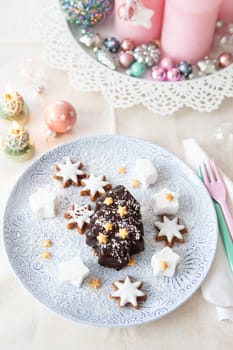 Chocolate covered ice cream in a Christmas tree shape with coconut
