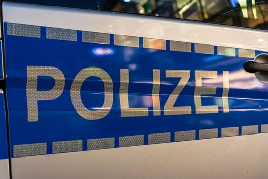 Afternoon Night City Lights Reflecting Against Police Car Letters German Sign European